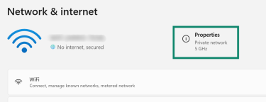 The Windows Network & internet settings screen. At the top, the current Wi-Fi connection is shown. A green box highlights the 'Properties' button on the right side.